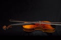 Violin and Bow on black Background with copy area Royalty Free Stock Photo
