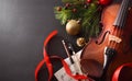 Violin with bow and sheet music on black background elevated Royalty Free Stock Photo