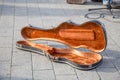 Violin case, black, open and empty.