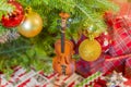 Violin cello wooden Christmas ornament hanging from tree with gi