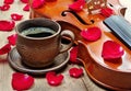 Violin and a cup of coffee. Coffee and rose petals. Top view. close up. Royalty Free Stock Photo