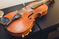 The violin on the dark table, Close - up of violin on the wooden floor, Top view of violin musical on dark wooden floor