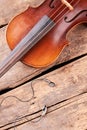 Violin and earphes on wooden boards.