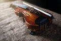 Violin, fiddlestick and bowtie, canvas background Royalty Free Stock Photo