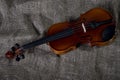 Violin, fiddlestick and bowtie, canvas background Royalty Free Stock Photo