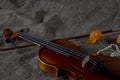 Violin, fiddlestick and bowtie, canvas background Royalty Free Stock Photo