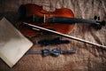 Violin, fiddlestick, notes and bowties closeup Royalty Free Stock Photo