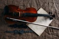 Violin, fiddlestick, notes and bowties closeup Royalty Free Stock Photo