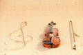 Violin and g clef on beach. Music concept