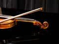Violin on the grand piano in a concert hall Royalty Free Stock Photo