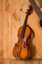 Violin and guitar on wood background Royalty Free Stock Photo
