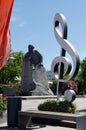 Violin key on the background of the monument to Karl Marx in the Theater square of the Russian capital.