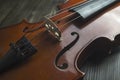 Violin lying on wooden background