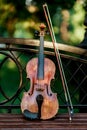 Violin music instrument of orchestra. Violins in the park on the bench Royalty Free Stock Photo