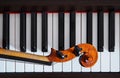 Violin neck on piano keys Royalty Free Stock Photo