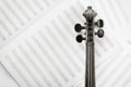 Violin neck on sheet with note lines, classical music background Royalty Free Stock Photo