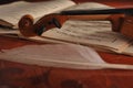 Violin and notes on the table Royalty Free Stock Photo