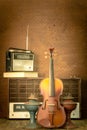 Violin and old radio in vintage style Royalty Free Stock Photo