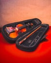 Violin in an open case on a red table. Royalty Free Stock Photo