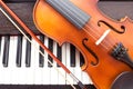 Violin on piano keyboard. Royalty Free Stock Photo