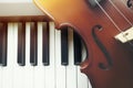 Violin on piano keyboard Royalty Free Stock Photo