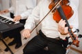 Violin playing viola musician playing . Man violinist classical musical instrument fiddle