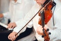 Violin playing viola musician. Man violinist classical musical instrument fiddle playing on wedding