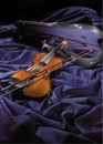 violin on purple velvet