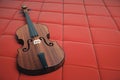 Violin on red background Royalty Free Stock Photo