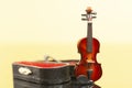 violin with red velvet case on a yellow background with reflection. Royalty Free Stock Photo