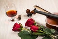 Violin, rose, glass of champagne and music books