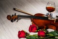 Violin, rose, glass of champagne and music books