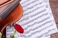 Violin, rose and music notes.