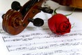 Violin, rose and sheet music