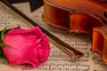 A violin, rose and sheet music Royalty Free Stock Photo