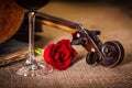 Violin scroll close with red rose Royalty Free Stock Photo