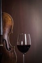 Violin waist detail with glass of wine Royalty Free Stock Photo