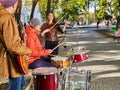 Festival music band. Friends playing on percussion instruments city park. Royalty Free Stock Photo