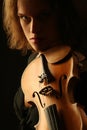 Violinist dark portrait on black Royalty Free Stock Photo