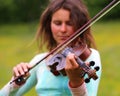 Violinist on a meadow Royalty Free Stock Photo