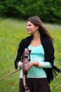 Violinist on a meadow Royalty Free Stock Photo