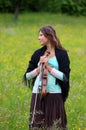 Violinist on a meadow full of flowers Royalty Free Stock Photo