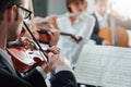 Violinist performing with classical orchestra Royalty Free Stock Photo