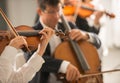 Violinist performing with orchestra Royalty Free Stock Photo