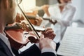 Violinist performing on stage with orchestra Royalty Free Stock Photo