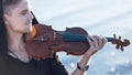 Violinist playing a violin, young man plays on