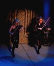 Violinists performing in lord of the dance Royalty Free Stock Photo
