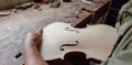 luthier carving and sculpting the f holes a violin with a knife