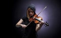 Violinst playing on instrument with empathy
