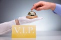 VIP Card In Front Of Person Ringing Service Bell